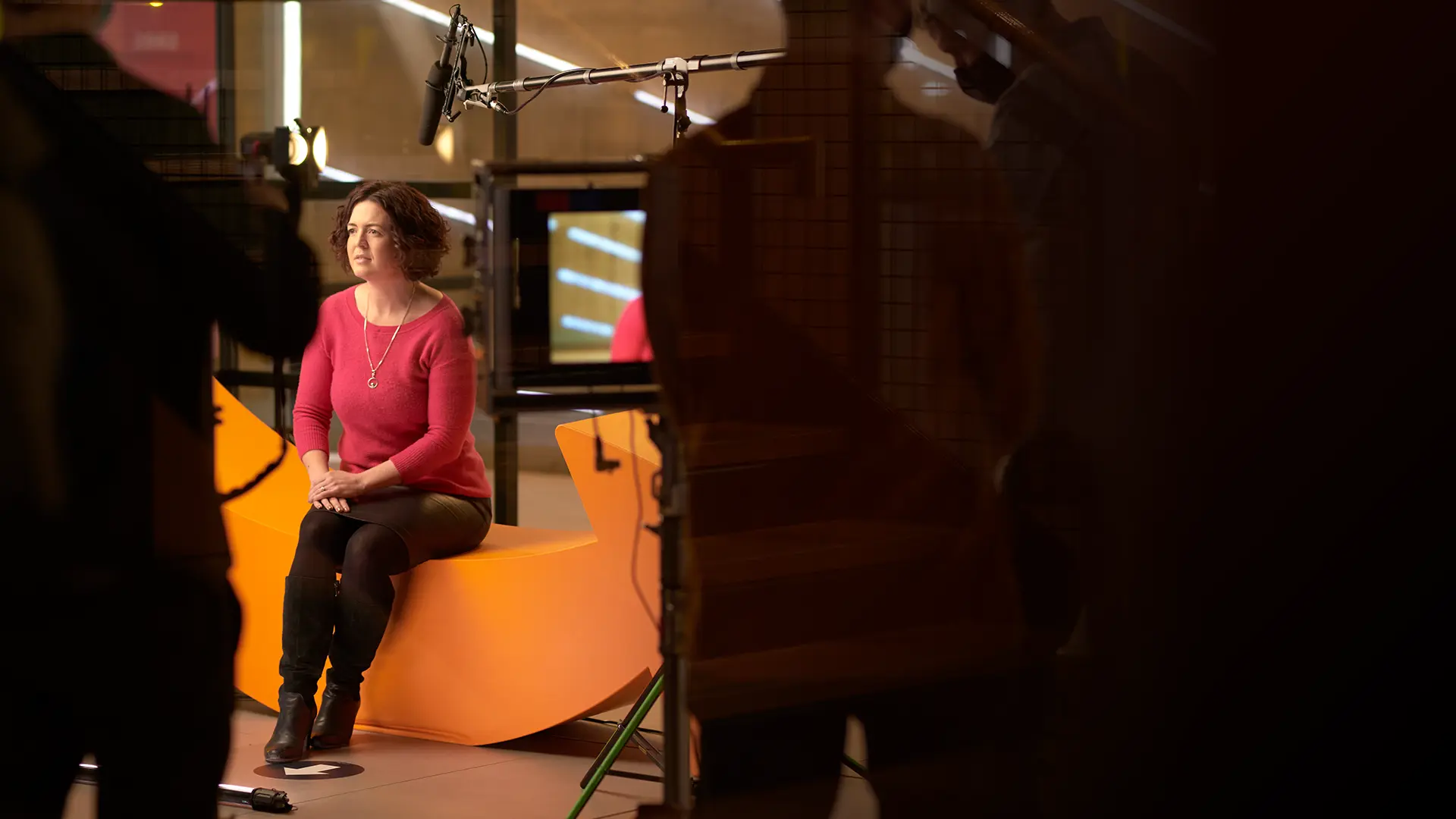 Beth Knight being filmed for Amazon on a professional video production set, surrounded by cameras and studio lighting.