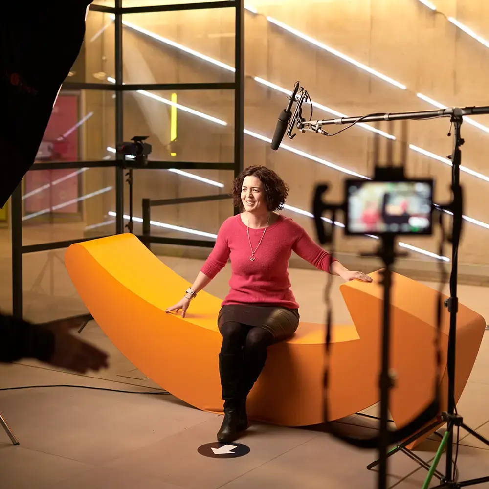 A BecomingX film crew recording an interview on location for Amazon.