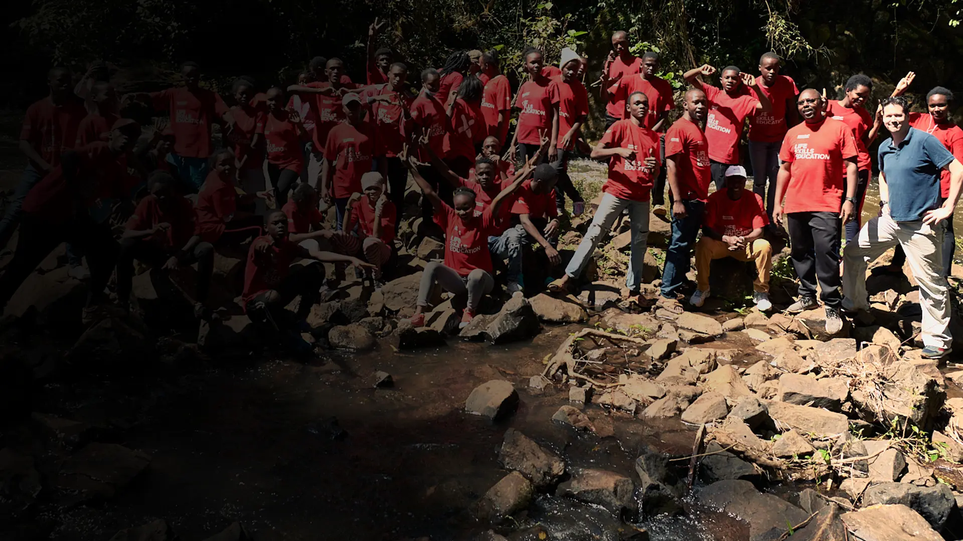 A group of students relaxing on a BecomingX Foundation project
